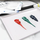 Fuumuui Ceramic Tray Palette with fresh dollops of red, green, and deep blue paint, ideal for artists mixing colors.