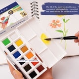 Fuumuui Tragbares 12-Farben-Aquarellfarben-Set geöffnet, mit farbenfrohen, festen Farben, einem mitgelieferten Pinsel und dem Deckel, der als Mischpalette für Fuumuui-Kunstbedarf verwendet wird.