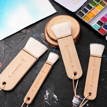 Fuumuui 4pcs wool watercolor brushes set (20mm, 30mm, 40mm, 50mm) with extra soft, high absorption bristles, perfect for washes, backgrounds, and large area painting, displayed alongside a watercolor palette.