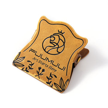 FUUMUUI Art Starts Here antique gold metal sketchbook clip with cat logo and floral engraving, ideal for holding 140lb watercolor paper and blocks for professional artists and beginners.