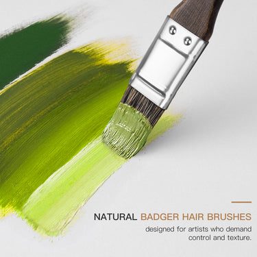 Fuumuui Art Supplies natural badger hair paint brush creating textured green oil or acrylic paint strokes on canvas, part of a professional artist paint brush set.