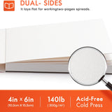 Fuumuui 4x6 100% Baumwolle Aquarellblock Journal, offen, um sein 140lb säurefreies Kaltpresspapier zu zeigen, das für die doppelseitige Verwendung und flache Doppelseiten konzipiert ist.