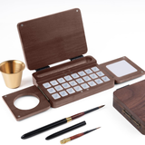 Fuumuui Travel Watercolor Palette, 24 grids, foldable wooden design, featuring a gold water cup and two sable travel watercolor brushes.