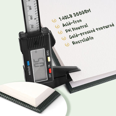 Fuumuui Watercolor Sketchbook featuring 100% cotton, 140lb 300gsm cold-pressed textured paper, with a digital caliper measuring its 0.5mm thickness and listing acid-free, pH neutral, and recyclable qualities.
