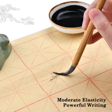 Fuumuui Chinese Calligraphy Wolf Sheep Mix Brush used for powerful writing on gridded practice paper with ink.