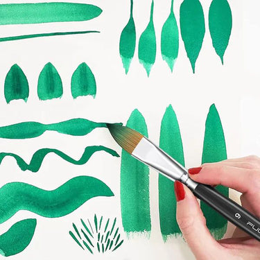 Fuumuui professional watercolor brush in action, painting diverse green strokes and leaf shapes on paper, demonstrating the versatility of Fuumuui 7pcs professional watercolor brushes.