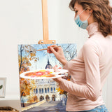 Un artista usa sapientemente un pennello professionale Fuumuui in scoiattolo sintetico rotondo per artisti per creare un dettagliato paesaggio ad acquerello, dimostrando i materiali artistici Fuumuui. <alt>Pennello Fuumuui: artista crea paesaggio ad acquerello</alt>