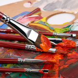 Fuumuui 6pcs Professional Red Sable Watercolor Filbert Brushes, one dipped in orange paint on a vibrant artist's palette.