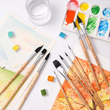 Pennelli professionali Fuumuui in scoiattolo sintetico da 10 pezzi per artisti, tra cui forme piatte, rotonde a punta, a daga, ovali a lingua di gatto, mostrati con vivaci acquerelli. <alt>Pennelli Fuumuui: acquerelli vivaci con pennelli in scoiattolo sintetico</alt>