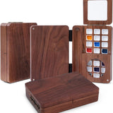 Fuumuui Travel Watercolor Palette 24 Grids. Elegant foldable wooden case displayed open, revealing vibrant paint pans and a compartment for 2pcs Sable Travel Watercolor Brushes.
