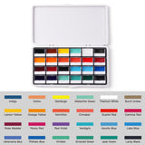 Fuumuui 24-Color Opaque Semi-Solid Watercolor Paint Set, open white tin displaying 24 vibrant pans and clearly labeled color swatches featuring rich earthy tones and a full spectrum of colors.