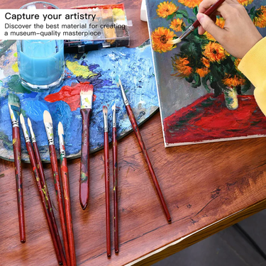 Fuumuui 11pcs Professional Bristle Oil Brushes in use by an artist painting sunflowers on a canvas, with a full set of Fuumuui oil paint brushes and a colorful palette on a wooden table.