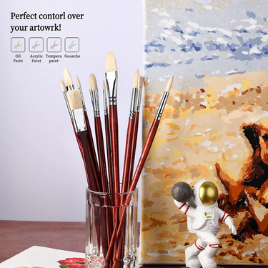 Fuumuui 11pcs Professional Bristle Oil Brushes in a glass holder next to an oil painting on canvas, suitable for acrylic, tempera, and gouache art.