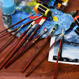 Fuumuui 11pcs Professional Bristle Oil Brushes on an artist's palette with oil paints and an artwork in progress.