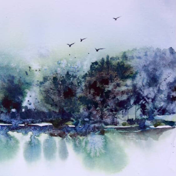 Atmospheric landscape watercolor painting of misty trees reflecting in water on 100% cotton cold press paper. Created using Fuumuui Art watercolor paint and professional squirrel hair brushes for soft, loose washes.