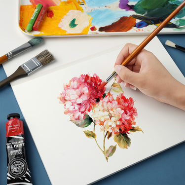 Fuumuui Art Supplies A4 20-sheet acrylic and oil painting pad in use, with an artist painting vibrant pink flowers, ideal for students, beginners, and professional painters.