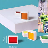 Fuumuui 24-Farben Aquarellfarben-Set, einzelne Farben in rot, orange, gelb und grün, die die kompakte Größe von 17 mm x 19,5 mm hervorheben.