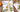 Fuumuui hog bristle paint brushes placed over an architectural oil painting artwork.
