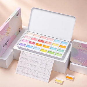 Fuumuui Creamora 24-color candy opaque watercolor paint set in open metal tin with color swatch sheet.