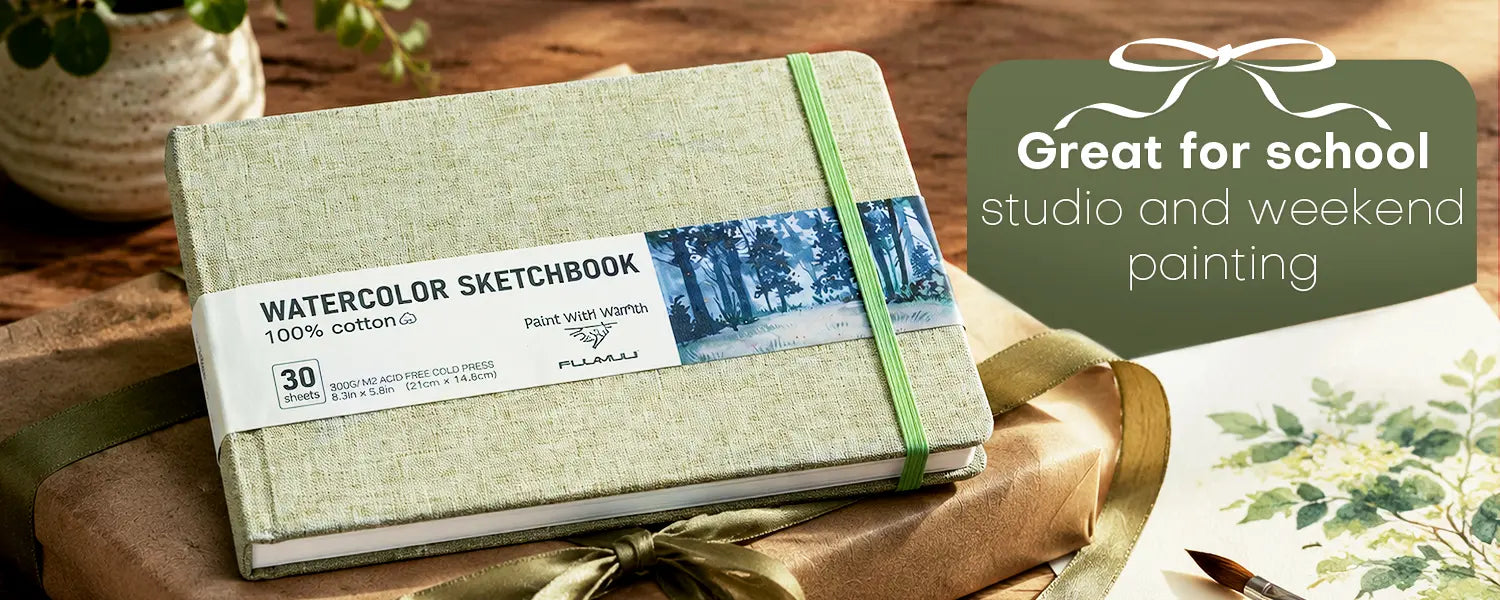 Fuumuui A5 landscape 100% cotton watercolor sketchbook packaged as a gift on a wooden desk.