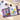 Open Fuumuui 36-color watercolor travel sketchbook purple large on desk with vibrant floral artwork.