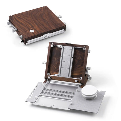 Fuumuui walnut plein air easel closed as a wooden box and opened as a portable painting workstation.