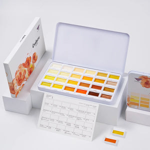 Complete Sunlit Yellow Creamora watercolor set displayed with original packaging box and swatch sheet.