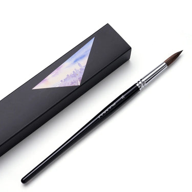 Single Fuumuui natural sable round watercolor brush size 12 laid next to its black presentation box.