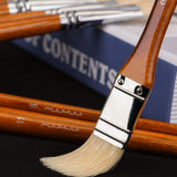 Fuumuui professional natural hog bristles paint brush with red handle, part of the 11-piece set.