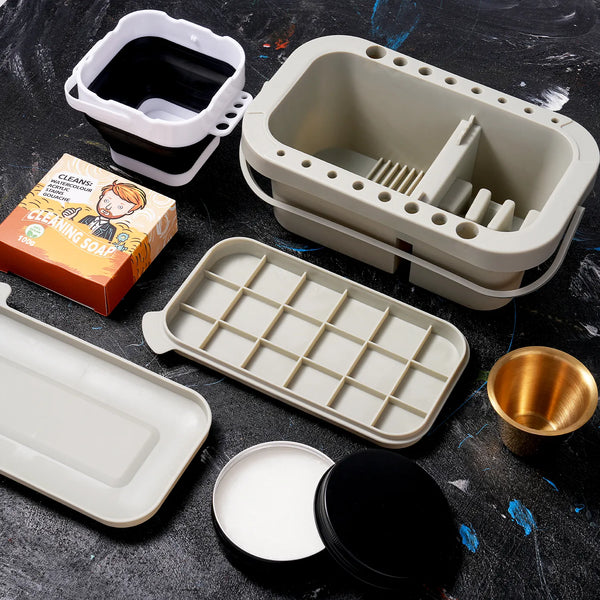 Professional paint brush cleaner kit featuring a multi-compartment wash basin, collapsible water bucket, plastic palette, and brush cleaning soap for watercolor, acrylic, and gouache. Essential tools for artists.