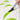 A Fuumuui & Coral Ye Chen dagger brush creating flowing green leaf strokes on white paper.