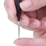 Fuumuui professional nylon detail brush with an ultra-fine tip, held by fingers.