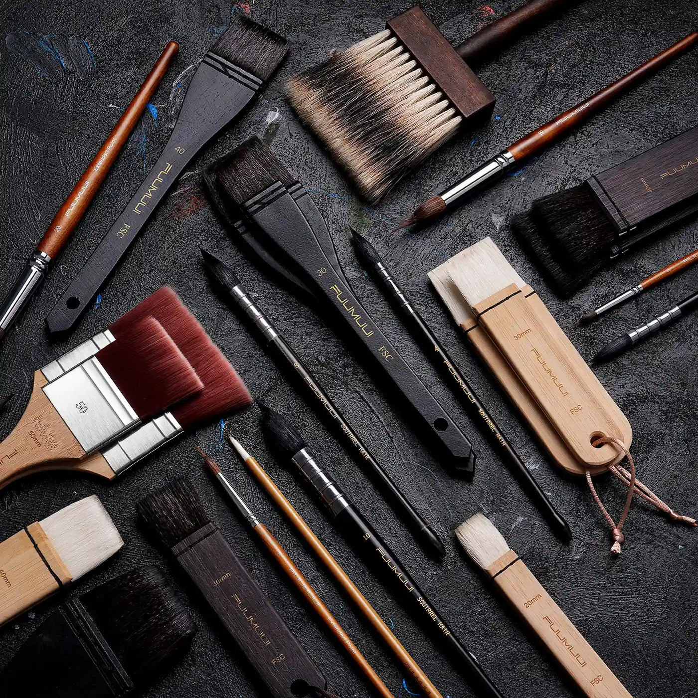 Variety of Fuumuui professional artist brushes featuring Squirrel Hair mop brushes, synthetic nylon flats, and Extended Point detail brushes in individual sizes for watercolor, oil, and acrylic paint.