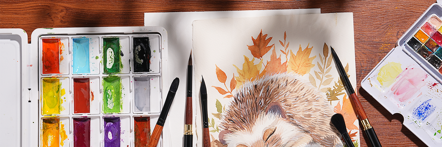 Squirrel hair watercolor brushes, including size 10 round and mop brush, alongside a professional watercolor paint set and travel palette on textured cold press paper with an autumn hedgehog illustration.