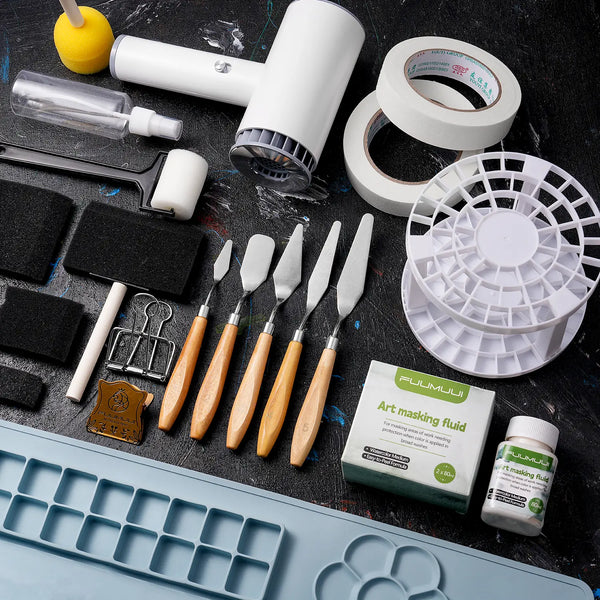 Essential art supplies including Fuumuui Art masking fluid, stainless steel palette knives, masking tape, foam brushes, a spray bottle, and a paint brush cleaner rack for professional watercolor and acrylic artists.