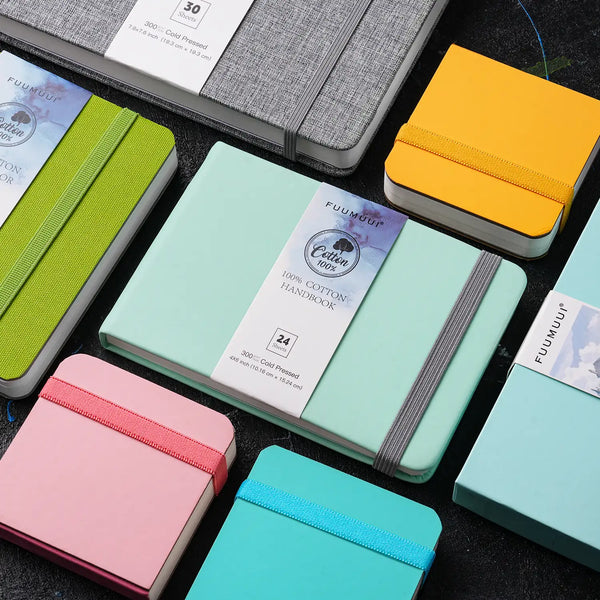 Fuumuui 100% Cotton Watercolor Sketchbook collection. Travel-sized 140lb/300gsm Cold Pressed handbooks in 4x6 inch and 7.6x7.6 inch sizes with elastic bands, perfect for professional artists and beginners.