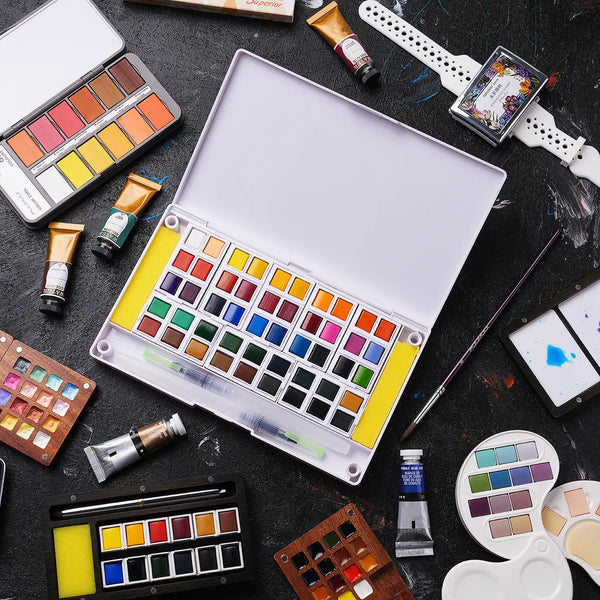 Fuumuui watercolor paint set with a large plastic travel palette of pans, pigment tubes including Cobalt Blue Hue, synthetic watercolor brushes, and mixing palettes for professional artists and beginners.