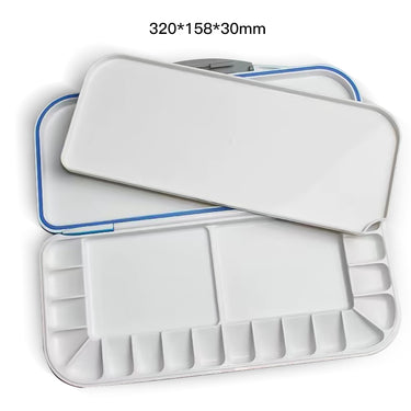 Palette d'aquarelle portable Fuumuui, plastique blanc, ouverte pour révéler 14 godets et deux grandes zones de mélange, 320x158x30mm.